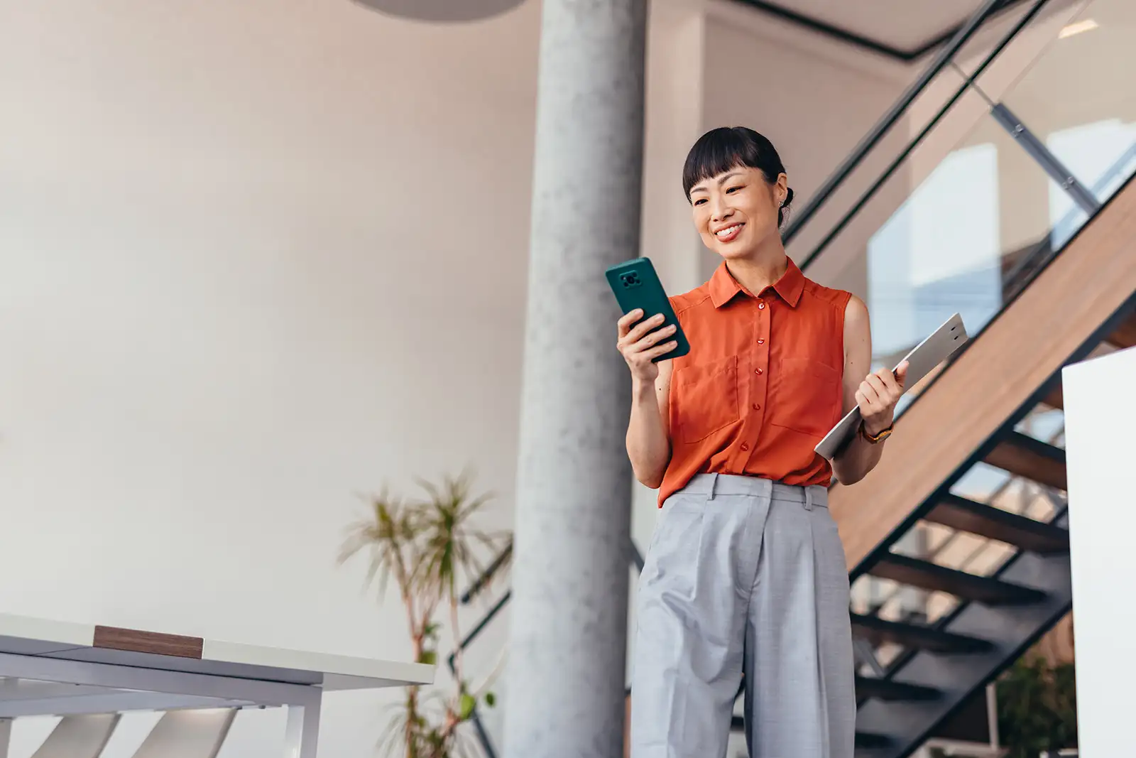 Woman holding a mobile device
